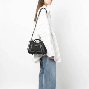 3.1 Phillip Lim Pashli Moto Nylon Satchel in black with silver-tone hardware